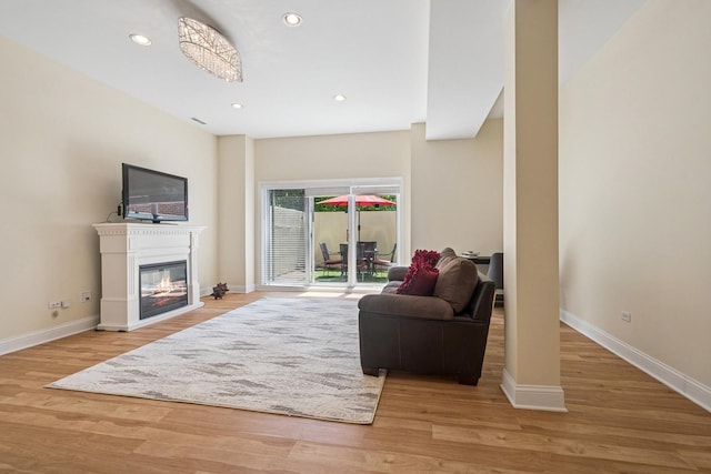 1720 W Diversey Pkwy Unit 1, Chicago, IL 60614 - living area featuring wood finished floors, recessed lighting, and a glass covered fireplace