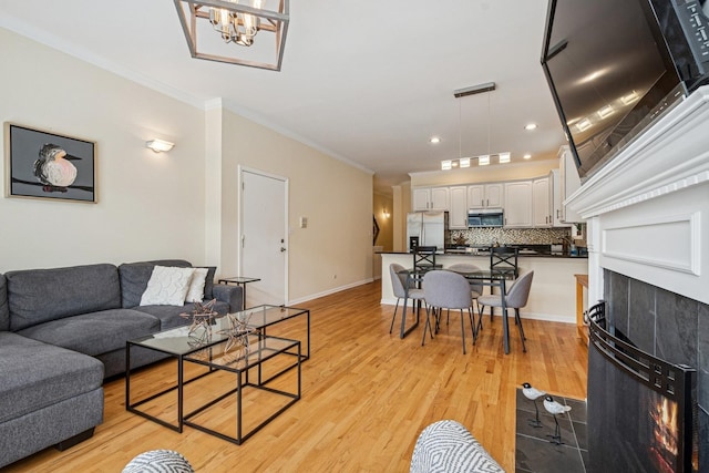 1720 W Diversey Pkwy Unit 1, Chicago, IL 60614 - living area with ornamental molding, light wood-style flooring, a chandelier, and recessed lighting