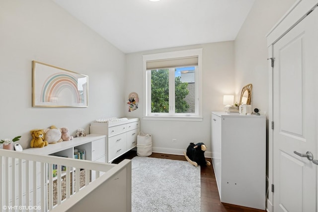 639 W Briar Pl Unit 4W, Chicago, IL 60657 - bedroom with dark wood-type flooring and a nursery area