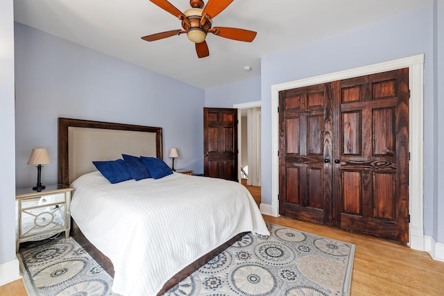 557 Garfield Ave, Aurora, IL 60506 - bedroom with light wood-style floors and a ceiling fan