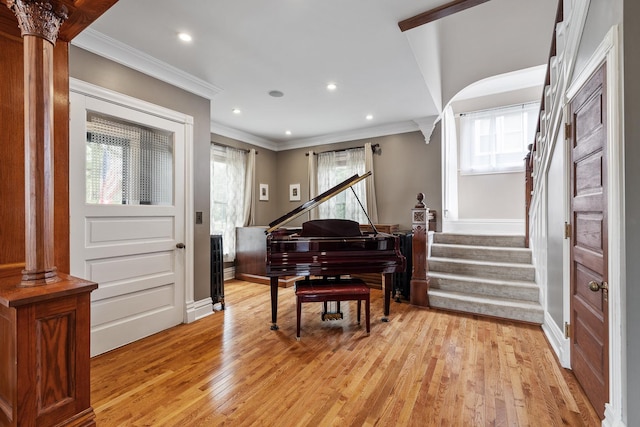 557 Garfield Ave, Aurora, IL 60506 - entrance foyer with light wood-style floors, healthy amount of natural light, crown molding, decorative columns, and recessed lighting