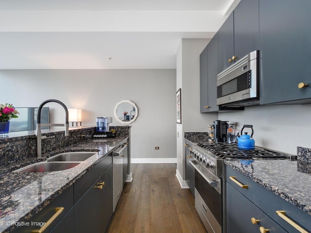 500 W Superior St Unit 1202, Chicago, IL 60654 - kitchen with stainless steel appliances, dark wood-style floors, and dark stone countertops