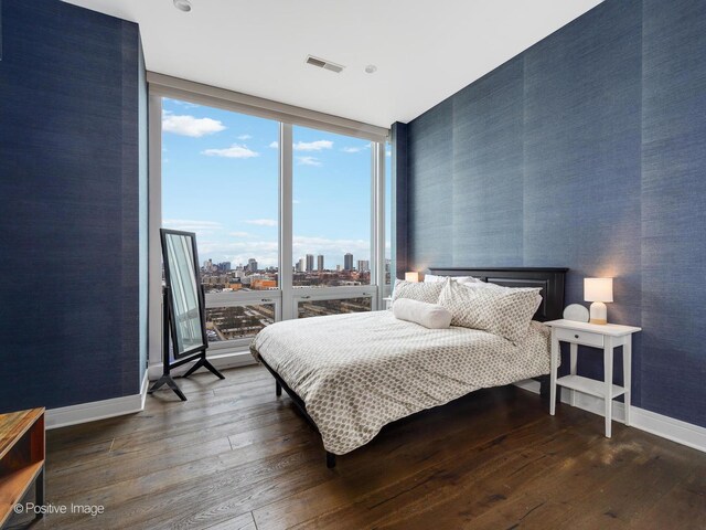 500 W Superior St Unit 1202, Chicago, IL 60654 - bedroom featuring floor to ceiling windows, wood-type flooring, and a view of skyline