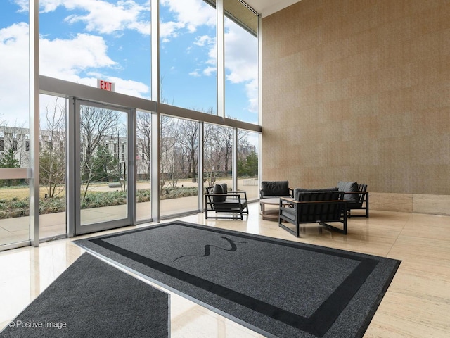 500 W Superior St Unit 1202, Chicago, IL 60654 - building lobby featuring a wall of windows and a towering ceiling