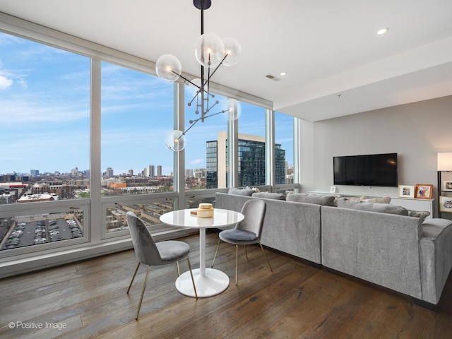 500 W Superior St Unit 1202, Chicago, IL 60654 - dining room with a view of skyline, a chandelier, dark wood-style flooring, and a wall of windows