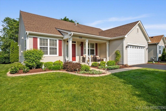 725 Bohannon Cir, Oswego, IL 60543 - ranch-style home featuring a porch, an attached garage, driveway, and a front lawn