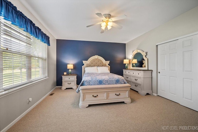 725 Bohannon Cir, Oswego, IL 60543 - bedroom with light carpet, a ceiling fan, and a closet