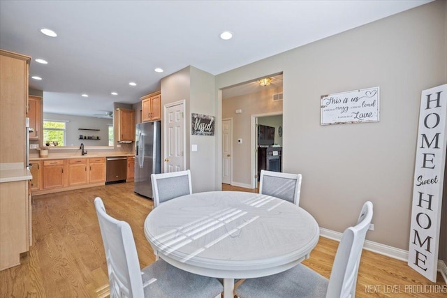 725 Bohannon Cir, Oswego, IL 60543 - dining area featuring light wood-style flooring and recessed lighting