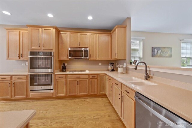 725 Bohannon Cir, Oswego, IL 60543 - kitchen featuring appliances with stainless steel finishes, light brown cabinetry, light countertops, and recessed lighting