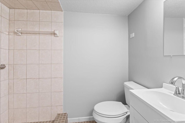 8826 Willow Rd, Hickory Hills, IL 60457 - bathroom with a textured ceiling, tiled shower, and vanity