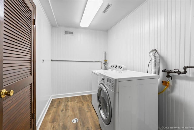 8826 Willow Rd, Hickory Hills, IL 60457 - laundry room with independent washer and dryer and dark wood finished floors