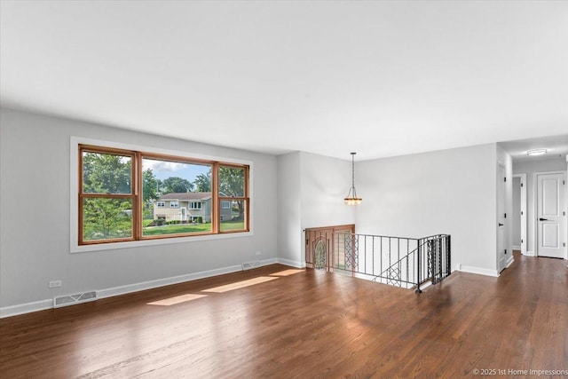 8826 Willow Rd, Hickory Hills, IL 60457 - unfurnished room featuring wood finished floors and a chandelier