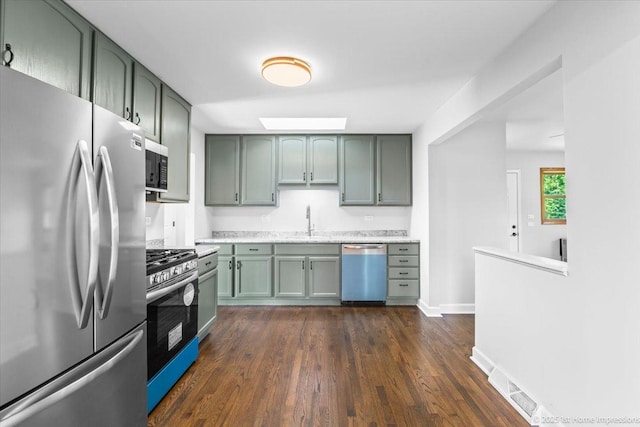8826 Willow Rd, Hickory Hills, IL 60457 - kitchen with appliances with stainless steel finishes, green cabinets, and dark wood finished floors