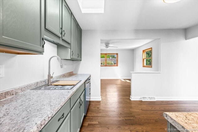 8826 Willow Rd, Hickory Hills, IL 60457 - kitchen featuring stainless steel dishwasher, light countertops, green cabinets, and dark wood-style flooring