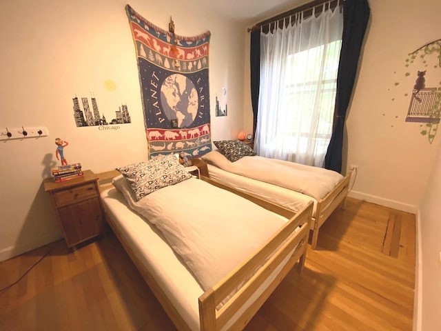 559 W Surf St Unit 101, Chicago, IL 60657 - bedroom with wood finished floors