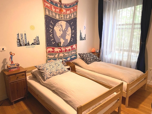 559 W Surf St Unit 101, Chicago, IL 60657 - bedroom with hardwood / wood-style flooring