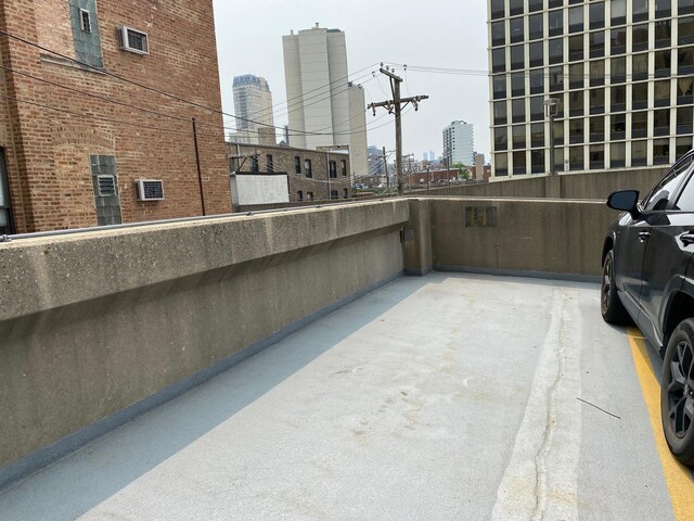 559 W Surf St Unit 101, Chicago, IL 60657 - view of patio / terrace with a city view