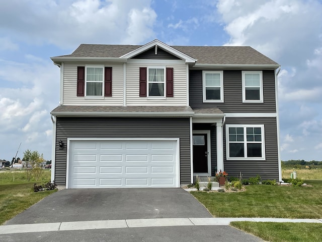 11300 Wildridge Ln, Huntley, IL 60142 - view of front facade featuring driveway, a front yard, a garage, and roof with shingles