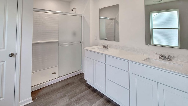 11300 Wildridge Ln, Huntley, IL 60142 - bathroom featuring a shower stall, wood finished floors, and double vanity