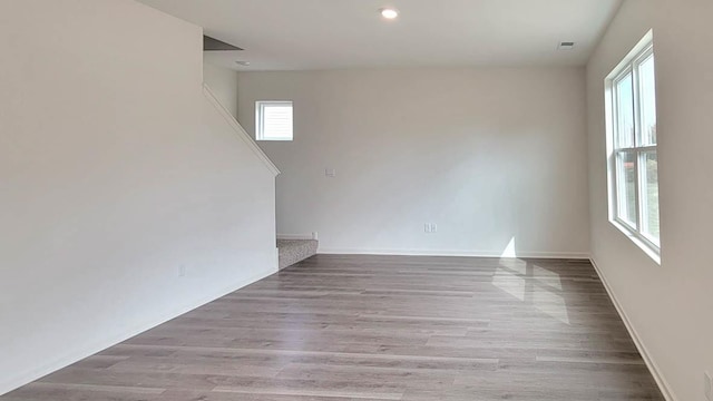 11300 Wildridge Ln, Huntley, IL 60142 - spare room with stairway, wood finished floors, and recessed lighting
