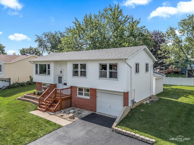 2211 Birchwood Pkwy, Woodridge, IL 60517 - split foyer home featuring an attached garage, asphalt driveway, and brick siding