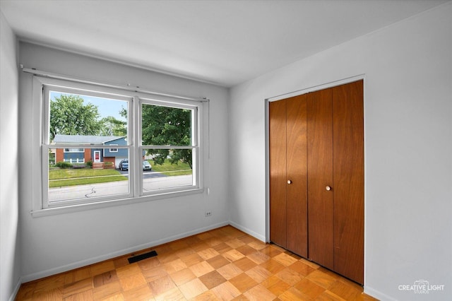 2211 Birchwood Pkwy, Woodridge, IL 60517 - unfurnished bedroom with a closet and baseboards