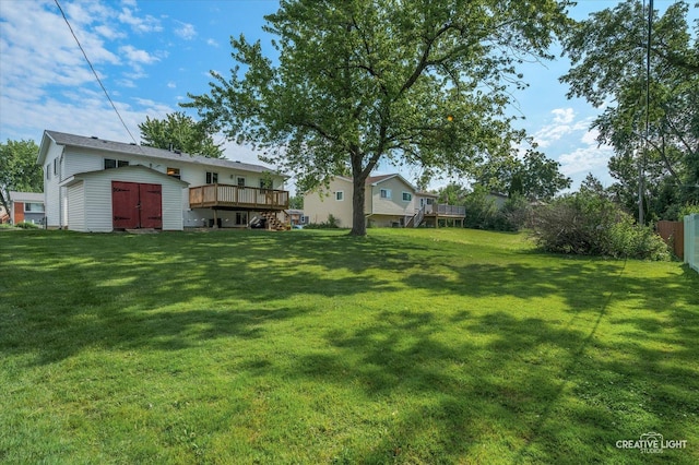 2211 Birchwood Pkwy, Woodridge, IL 60517 - view of yard with a wooden deck and a storage unit