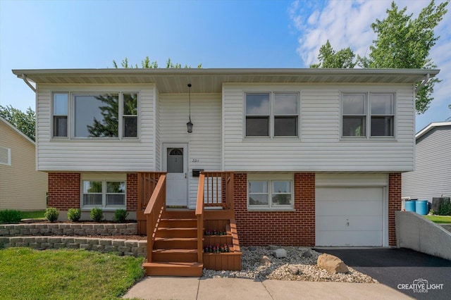 2211 Birchwood Pkwy, Woodridge, IL 60517 - bi-level home featuring brick siding, driveway, and an attached garage