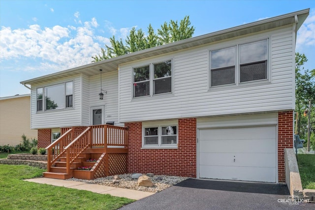 2211 Birchwood Pkwy, Woodridge, IL 60517 - split foyer home featuring brick siding, a garage, and driveway