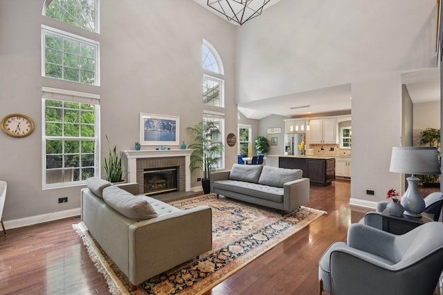 765 Providence Ln, Crystal Lake, IL 60012 - living room featuring a high ceiling, dark wood-style flooring, and healthy amount of natural light