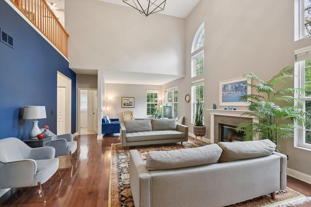765 Providence Ln, Crystal Lake, IL 60012 - living area with a high ceiling, hardwood / wood-style floors, healthy amount of natural light, and a brick fireplace