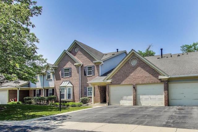 2406 Mallow Ct Unit V2, Schaumburg, IL 60194 - traditional home with brick siding, asphalt driveway, an attached garage, and a shingled roof