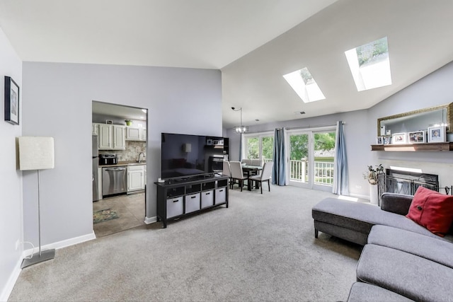 2406 Mallow Ct Unit V2, Schaumburg, IL 60194 - living room with light colored carpet, a skylight, and high vaulted ceiling