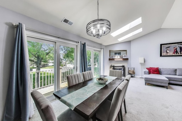 2406 Mallow Ct Unit V2, Schaumburg, IL 60194 - carpeted dining space featuring vaulted ceiling, a skylight, and a chandelier