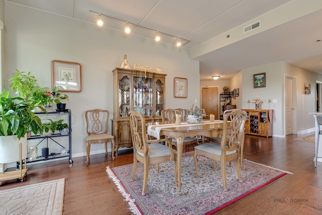 1199 E Port Clinton Rd Unit 209, Vernon Hills, IL 60061 - dining area featuring rail lighting and wood finished floors