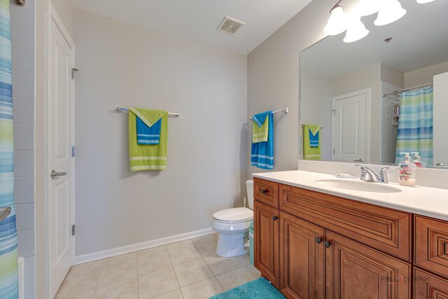 1199 E Port Clinton Rd Unit 209, Vernon Hills, IL 60061 - bathroom featuring tile patterned floors, vanity, and a shower with curtain