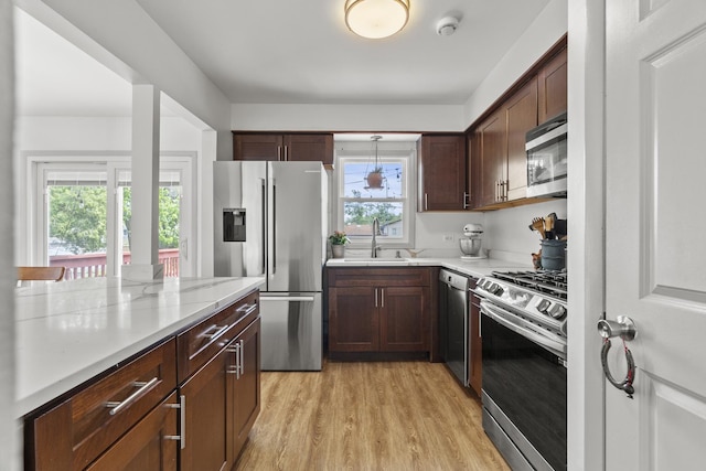 16401 Clark Ln, Tinley Park, IL 60477 - kitchen with stainless steel appliances, light wood-style flooring, dark brown cabinets, and pendant lighting
