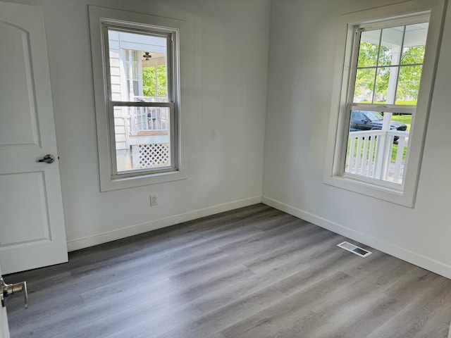 616 N Everett St, Streator, IL 61364 - empty room featuring healthy amount of natural light and wood finished floors