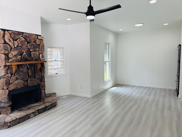 616 N Everett St, Streator, IL 61364 - unfurnished living room featuring light wood finished floors, recessed lighting, a ceiling fan, and a fireplace