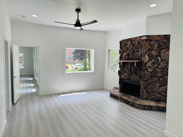616 N Everett St, Streator, IL 61364 - unfurnished living room featuring light wood-style flooring, ceiling fan, and recessed lighting