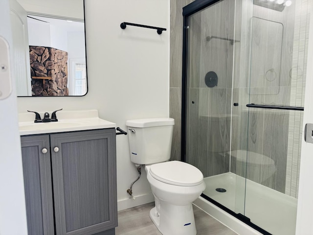 616 N Everett St, Streator, IL 61364 - full bathroom with a stall shower, vanity, and wood finished floors