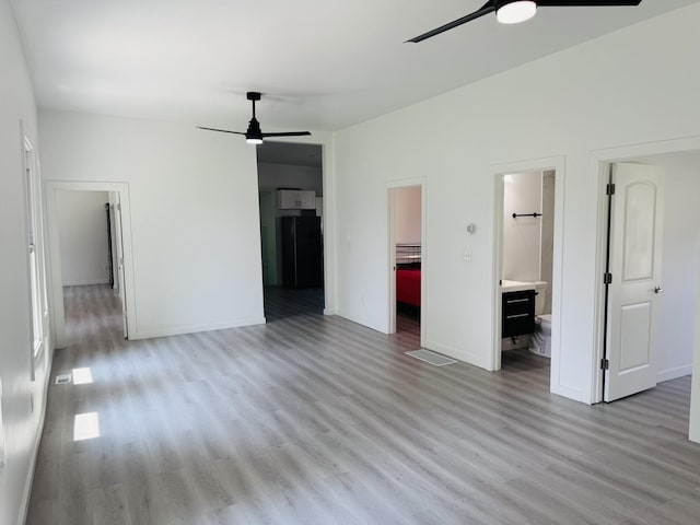 616 N Everett St, Streator, IL 61364 - unfurnished living room featuring ceiling fan and light wood-type flooring