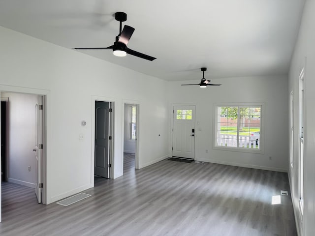 616 N Everett St, Streator, IL 61364 - unfurnished living room featuring a ceiling fan and wood finished floors