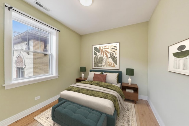 4333 N Troy St Unit 3E, Chicago, IL 60618 - bedroom featuring multiple windows and wood finished floors