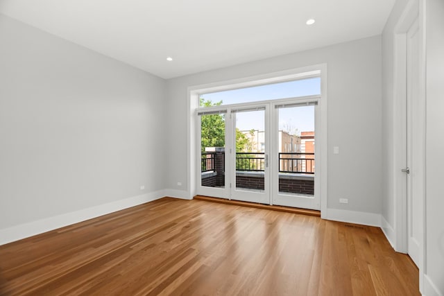 4133 N Kenmore Ave Unit 2S, Chicago, IL 60613 - empty room with light wood-style floors and recessed lighting
