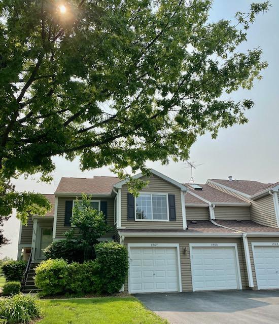 1967 Windsong Dr, Schaumburg, IL 60194 - view of front of house with driveway and a garage