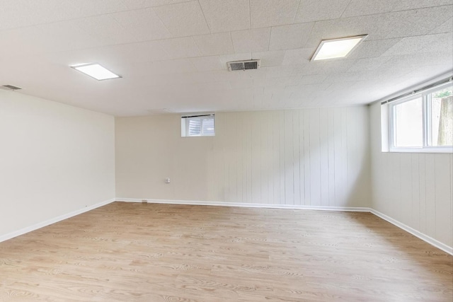 471 Highcrest Dr, Wilmette, IL 60091 - basement with light wood-type flooring and wood walls
