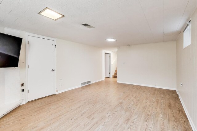 471 Highcrest Dr, Wilmette, IL 60091 - spare room with light wood-style flooring and stairway