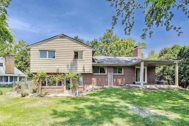 471 Highcrest Dr, Wilmette, IL 60091 - back of property featuring brick siding, a chimney, and a patio