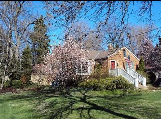 500 N Grant St, Westmont, IL 60559 - view of front of house with a front yard and a chimney